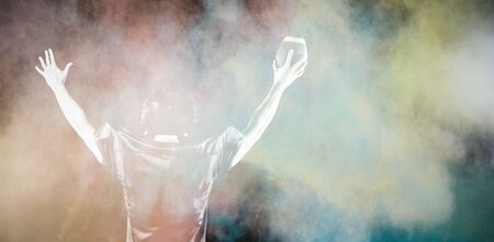 American Football Player against splashing of color powderの写真素材