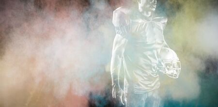 Strong Rugby Player against splashing of color powderの写真素材