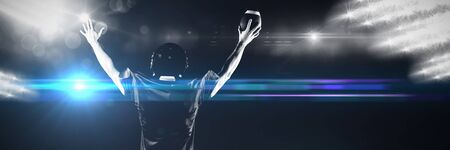 American Football Player against view of spotlightsの写真素材