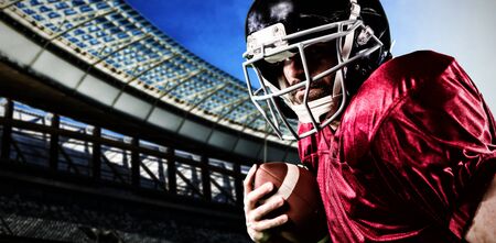 American Football Player against rugby stadium on a sunny day