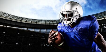 Strong Rugby Player against rugby stadium on a sunny dayの写真素材
