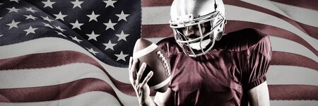 American Football Player against digitally generated united states national flagの写真素材