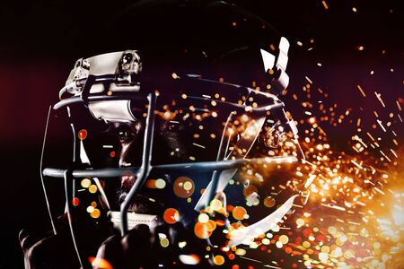 Strong Rugby Player against firework bursting sparkle backgroundの写真素材