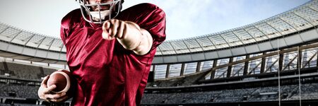 American Football Player against rugby stadium on a sunny dayの写真素材