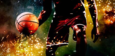 Basketball player against splashing of powderの写真素材