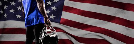 Strong Rugby Player against american flagの写真素材