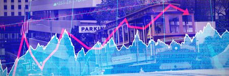 Stocks and shares against tram moving on a track across the town streetの写真素材