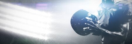 Strong Rugby Player against spotlightsの写真素材