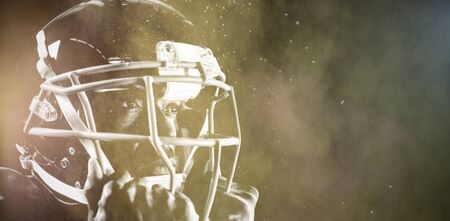 Strong Rugby Player against splashing of color powderの写真素材