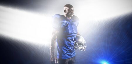 Strong Rugby Player against spotlightsの写真素材