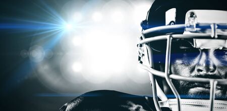 American Football Player against spotlightsの写真素材