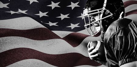 American Football Player against focus on usa flagの写真素材