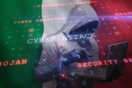 Hacker using credit card for cyber crime against digitally generated italian national flag