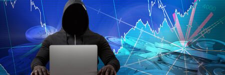 Male hacker with laptop on table  against bitcoins