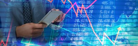 Mid-section of business man using smartphone against bitcoins
