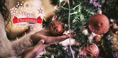 Christmas card against girl at home at christmas timeの写真素材
