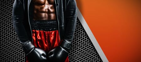 Boxer posing after failure against black metal textureの写真素材