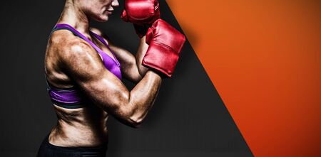 Side view of boxers with fighting stance against black metal textureの写真素材