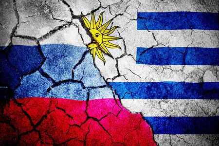 Digitally generated uruguay national flag against digitally generated russian national flagの写真素材