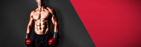 Muscular boxer against black metal textureの写真素材