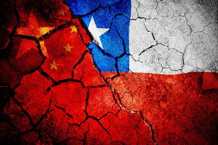 Digitally generated chile national flag against close-up of chinese flagの写真素材