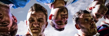 Rugby players against sky and cloud on a sunny dayの写真素材