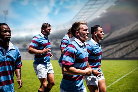 Rugby players against rugby stadiumの写真素材