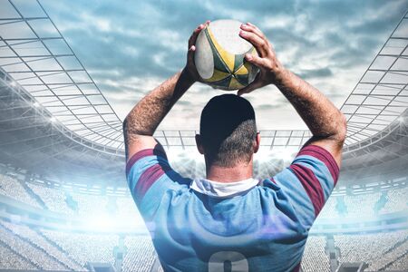 Rugby player against soccer stadiumの写真素材