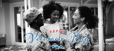Veterans day against soldier couple and daughterの写真素材