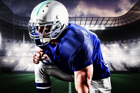 American football player against view of a sports arenaの写真素材