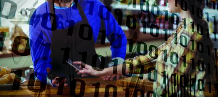 Binary code on circuit board against woman paying bill through smartphone using nfc technology