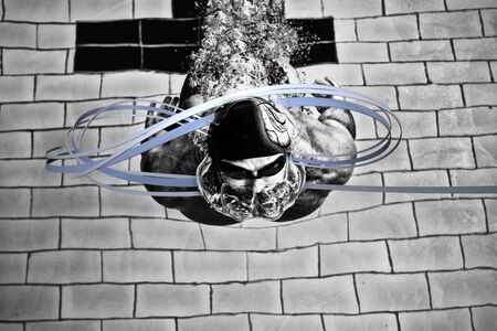 Grey line design against swimmer swimming in the pool