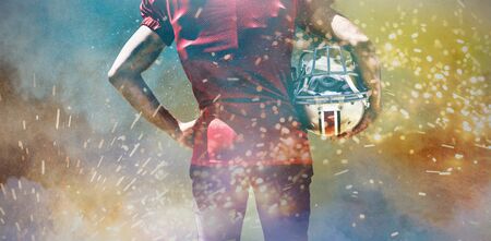 American Football Player against splashing of powderの写真素材