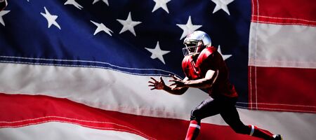 American Football Player against close-up of an american flagの写真素材