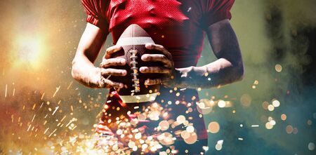 American Football Player against splashing of powderの写真素材