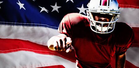 American Football Player against close-up of an american flagの写真素材