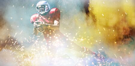 American Football Player against splashing of powderの写真素材