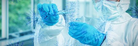 Digital image of blue coronavirus against protected scientist pouring liquid. Testing for...