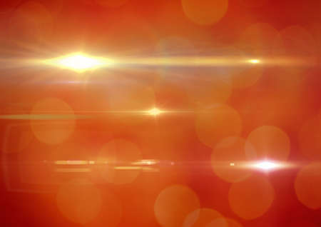 Glowing orange spots of light and light trails over orange background. light and colour concept...