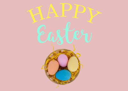Happy easter text with flowers and easter eggs in basket on pink background. easter holiday...