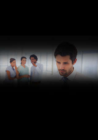 Caucasian businessman with diverse colleagues talking secretively in background seen through slit....