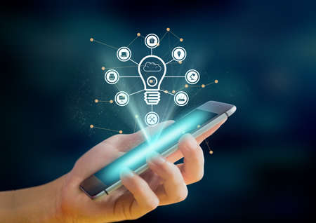 Digital interface with digital icons against person using smartphone. global networking and business technology conceptの写真素材