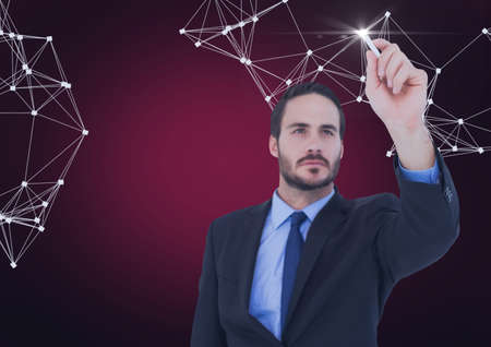 Network of connections against businessman writing on invisible screen against red background. global networking and business conceptの写真素材