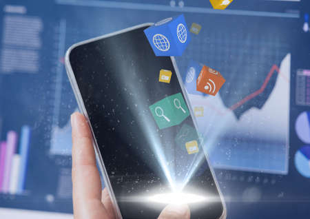 Social media icons floating over hand holding smartphone against statistical data processing. social...