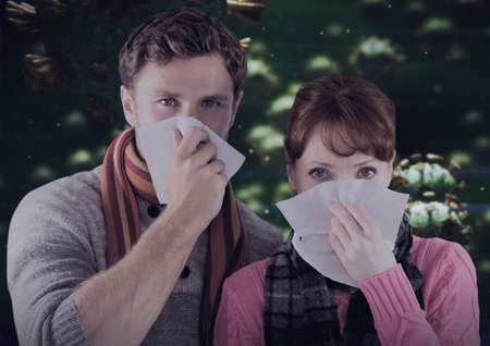 Composition of covid 19 cells over sick man and woman blowing their noses. global coronavirus...