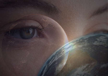 Digital composite image of spot of light and globe against close up of female human eye. cyber security and digital interface technology conceptの写真素材