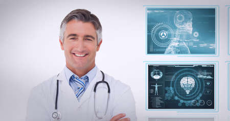 Portrait of caucasian male doctor smiling against screens of medical data processing. medical research and technology conceptの写真素材