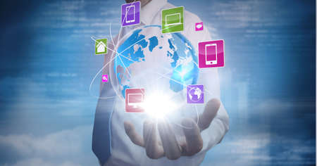 Composition of network of digital icons with globe over hand of businessman. global technology and...