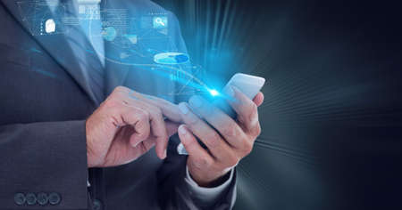 Composition of data processing and statistics over man using smartphone. global technology and digital interface concept digitally generated image.の写真素材