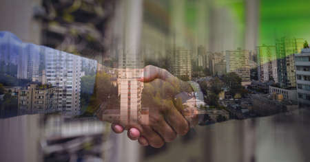 Composition of businessmen shaking hands with cityscape. global finance, business and connection...
